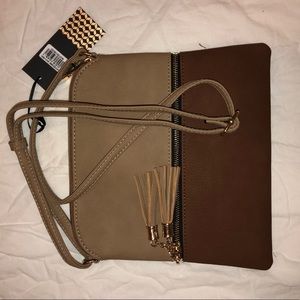 Adorable brown and gold Deluxity bag with tags